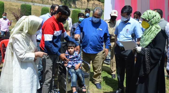Asgar Samoon distributes aiding kits among specially abled children