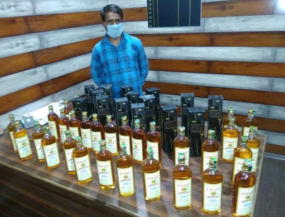 SRINAGAR POLICE ARRESTED BOOTLEGGER, 45 BOTTLES OF ALCOHOL RECOVERED.