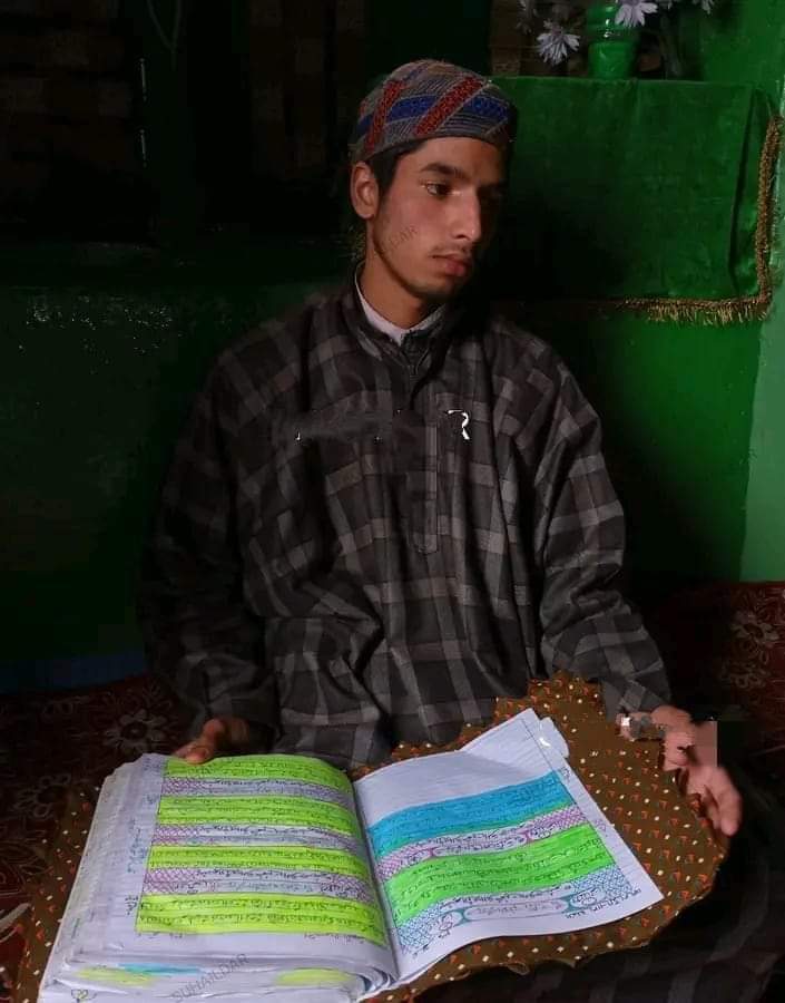 17-year-old Kulgam youth writes Quran with his hand in two months